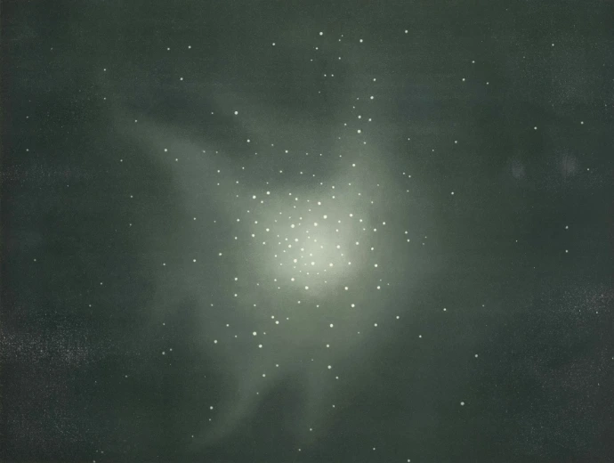 A cluster of bright lights against a dark, hazy background.